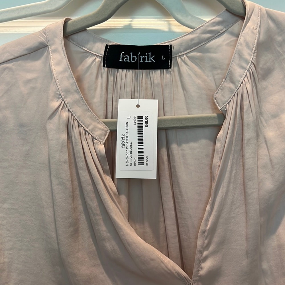 Blush silk blouse with bell sleeves